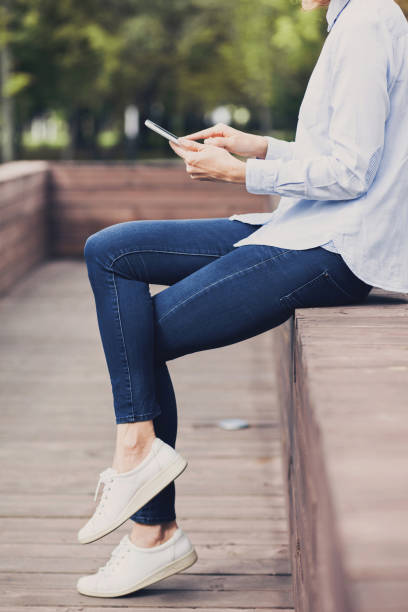 istock Young woman using digital tablet outdoors 652224642
