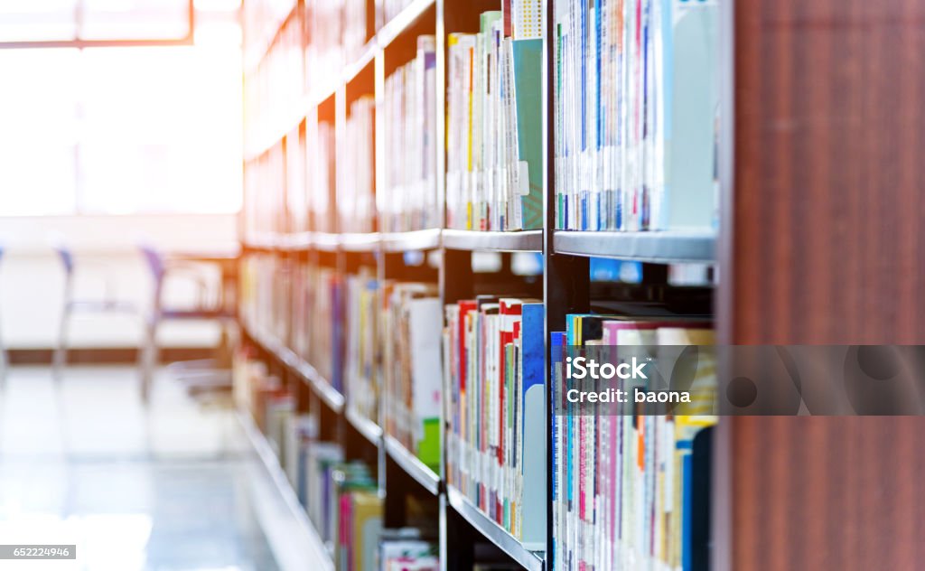 University library University library with large group of books on the shelf. Library Stock Photo