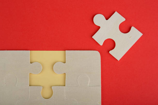 istock Business Teamwork Concept - Jigsaw Puzzle Pieces on red background 652225058