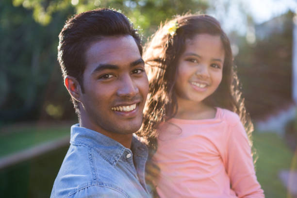 istock Father carrying daughter in his arms 652225704