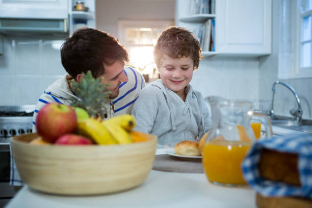 istock Father and son having breakfast in the kitchen 652225876