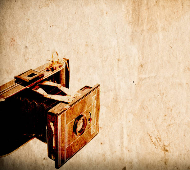 Antique camera on vintage paper background