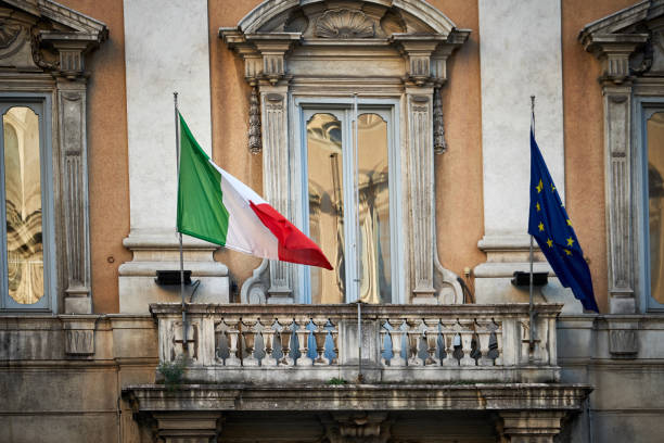 Rome, Italy - March 5, 2017: The Italian and European flags on a building balcony, downtown Rome