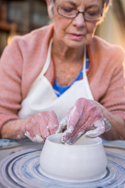 istock Close-up of female potter making pot 652235766