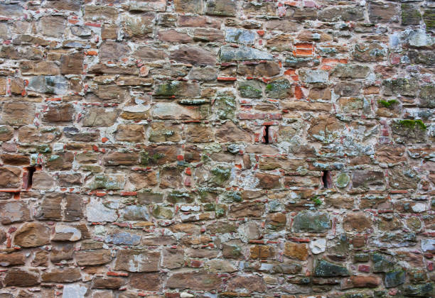 istock The natural texture of stone, brick brown, green, red wall 652240848