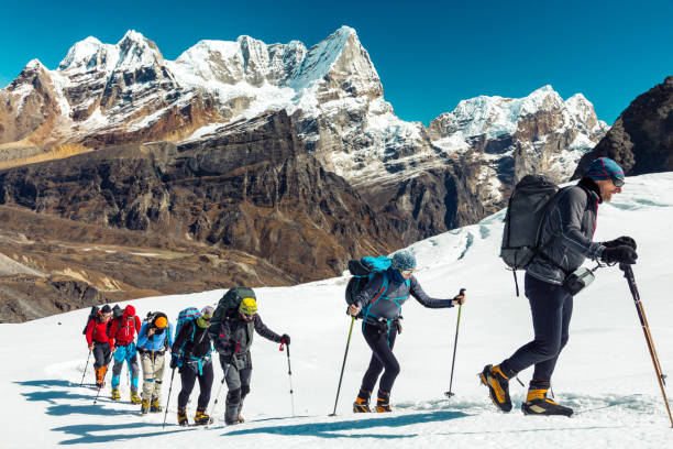 istock Mountain Panorama View and Climbers walking up on Snow Terrain 652240960