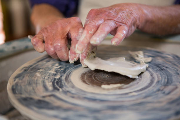 istock Close-up of potter removing clay from pottery wheel 652241948