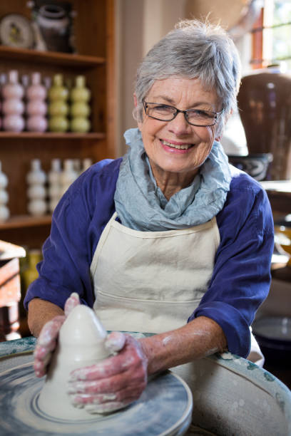istock Portrait of female potter making pot 652241986
