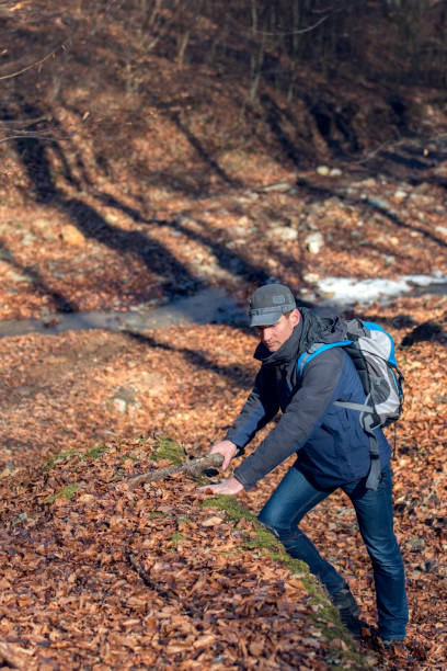istock Male hiking through the woods in early spring 652244498
