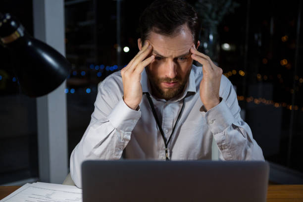 istock Frustrated businessman sitting in office 652244812