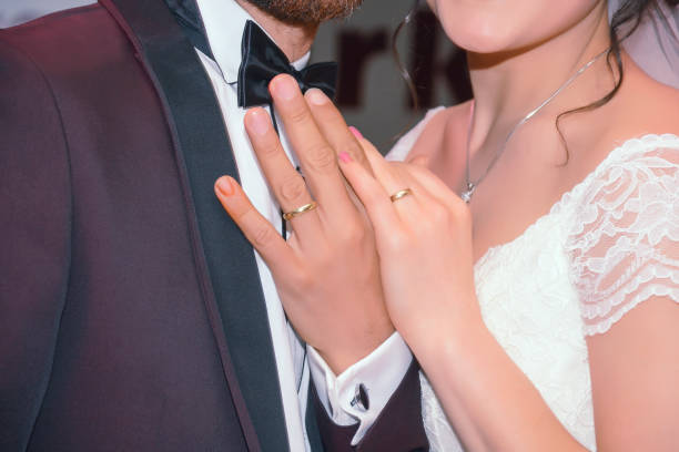 istock bride ans groom showing wedding rings 652251480