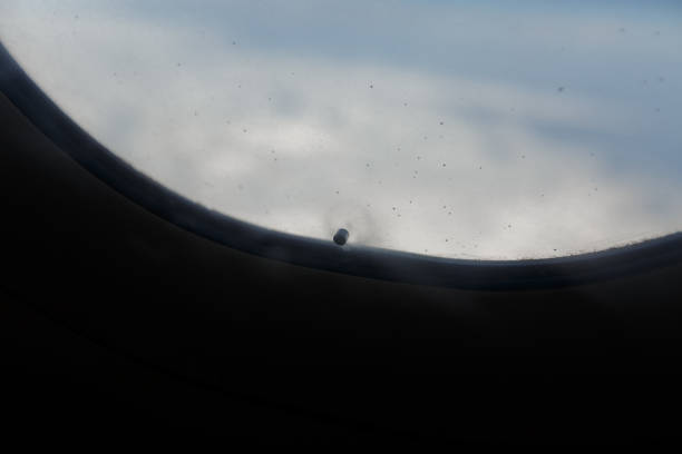 istock little hole in airplane window 652269918