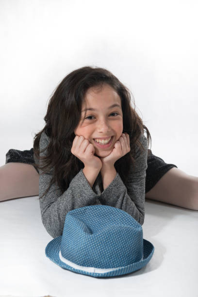 istock Little Girl With Blue Hat On Grey Background 652270320