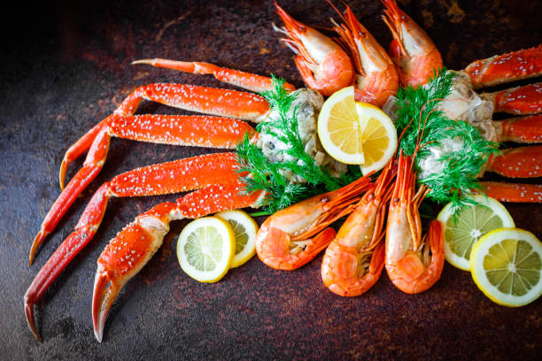 istock Crab legs with lemon and shrimps 652273984