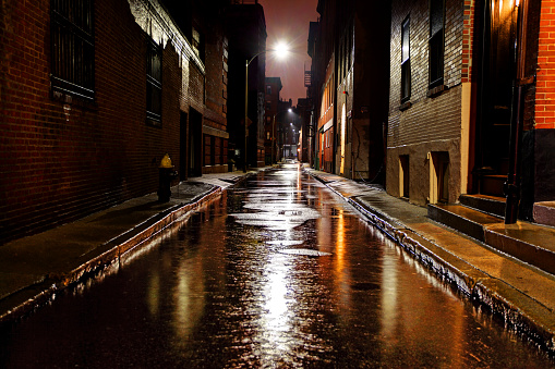 Empty rain-soaked city street in Boston Massachusetts