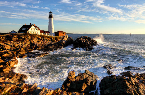 Portland Head Lighthouse Portland Head Lighthouse is a historic lighthouse in Cape Elizabeth, Maine. The light station is automated, and the tower, beacon, and foghorn are maintained by the United States Coast Guard. The light station sits on a head of land at the entrance of the primary shipping channel into Portland Harbor, which is within Casco Bay in the Gulf of Maine. lighthouse maine new england coastline stock pictures, royalty-free photos & images