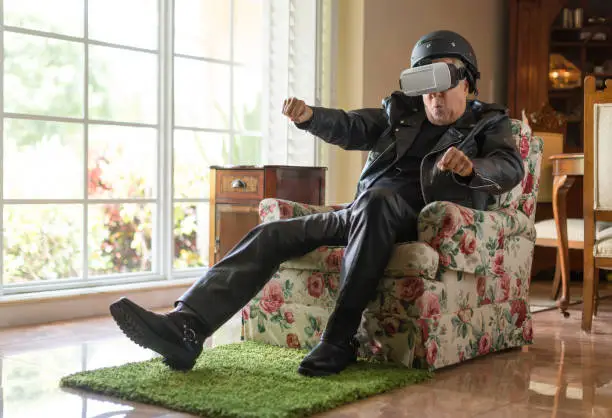 Photo of Old biker using virtual reality