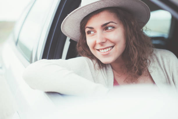 istock Curly woman travelling in the car 652291174