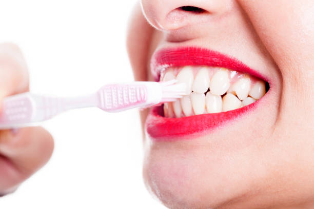 istock Woman Cleaning Teeth 652303958