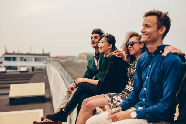 istock Friends sitting together on rooftop 652304646