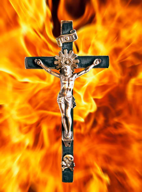 istock Jesus Chrit cross against fire flames 652311758