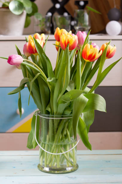 istock Colorful tulips in glass vase. 652317846