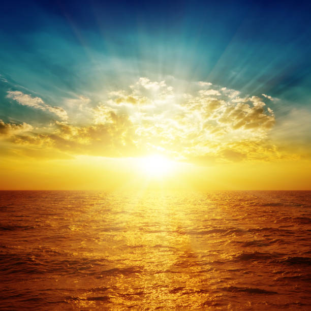 istock orange sea in sunset and clouds over it 652318190