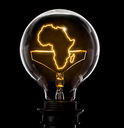 Foco con un alambre que brilla intensamente en la forma de África (serie) photo