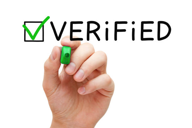 Verified Green Check Mark Concept Hand putting check mark on Verified with green marker isolated on white. "n validation photos stock pictures, royalty-free photos & images