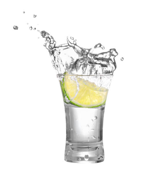 istock vodka or tequila in glass with lime slice 652327338