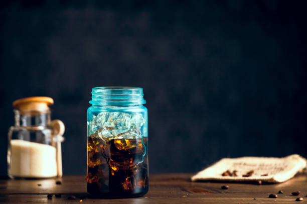 istock Iced Organic Coffee Served In Blue Mason Jar On Table With Natural Sugar. Copy Space With Selective Focus. 652330950