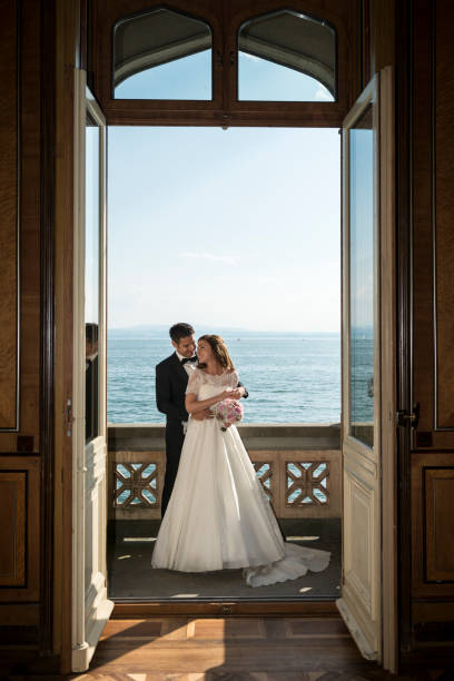 istock bridal couple standing on balcony from old villa 652337904