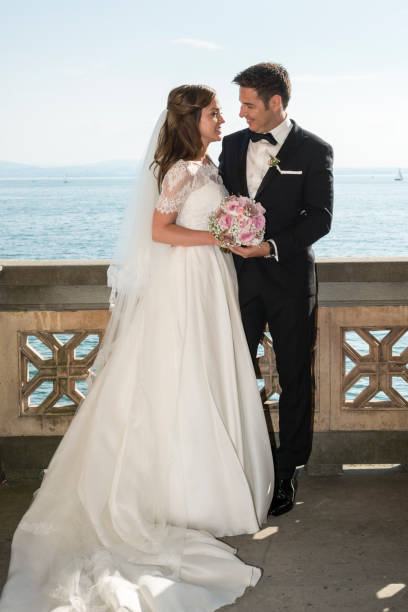 istock bridal couple standing on balcony from old villa 652338214