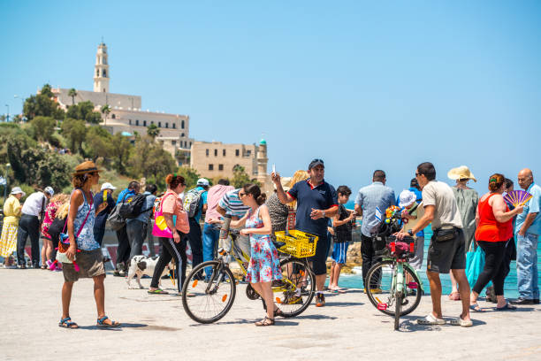 Tel Aviv, Israel - May 12, 2016:  Tel Aviv beaches crowded with people celebrating Independence Day. Crowds on the beach are getting ready to watch air show.