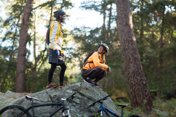 istock Biker couple interacting with each other in forest 652352328