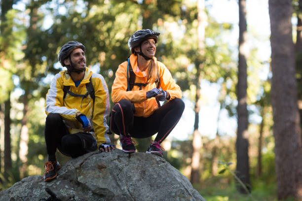 istock Biker couple looking at a view in forest 652352386