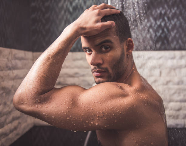 istock Afro American man taking shower 652356982