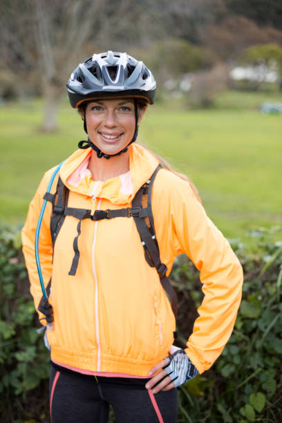 istock Female biker smiling in countryside 652359972