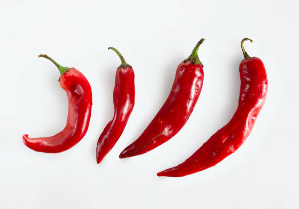istock Red chili peppers on white background 652373566