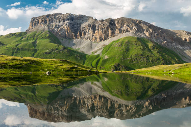 istock Beautiful mountain  and clouds reflected in the clear lake 652380726