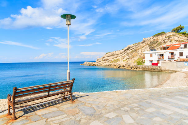 istock Bench on coastal promenade along Kokkari beach, Samos island, Greece 652383140