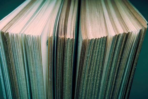 istock View of old book pages. Education and wisdom concept. 652385358
