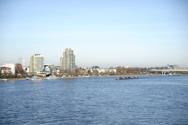 Ships are moored in Cologne or are navigating on the river Rhine.