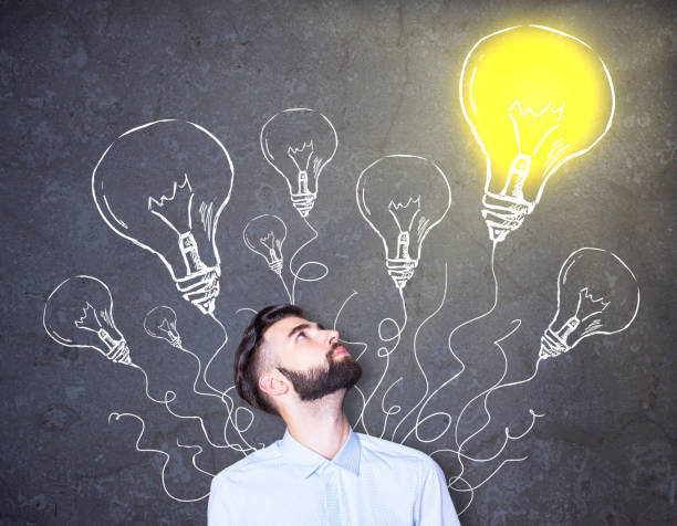 istock businessman with lighbulb drawings 652397638