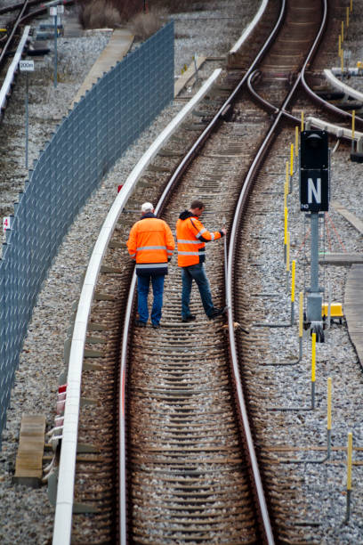 Railroad workers maintaing railways in Munich, 2015 stock photo