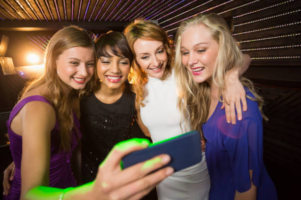 istock Smiling friends taking a selfie from mobile phone 652401260