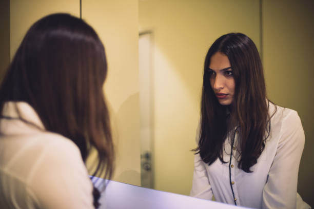 istock Sexy woman and her reflection in mirror 652411382