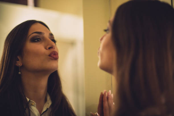 istock Sexy woman and her reflection in mirror 652411460