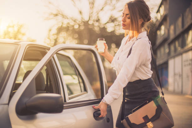 istock Bussines woman getting into car 652417650