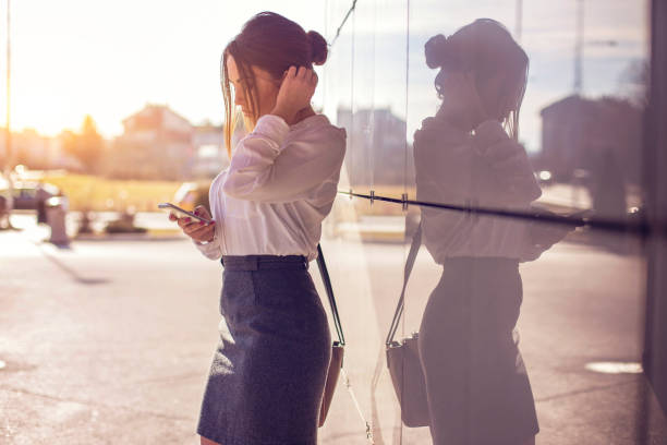 istock Businesswoman using mobile phone outdoors 652417710